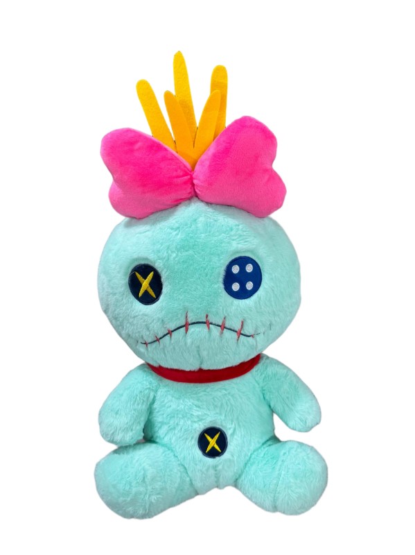 Scrump plush — Turquoise body, stitched face motif, pink bow and yellow tufts.