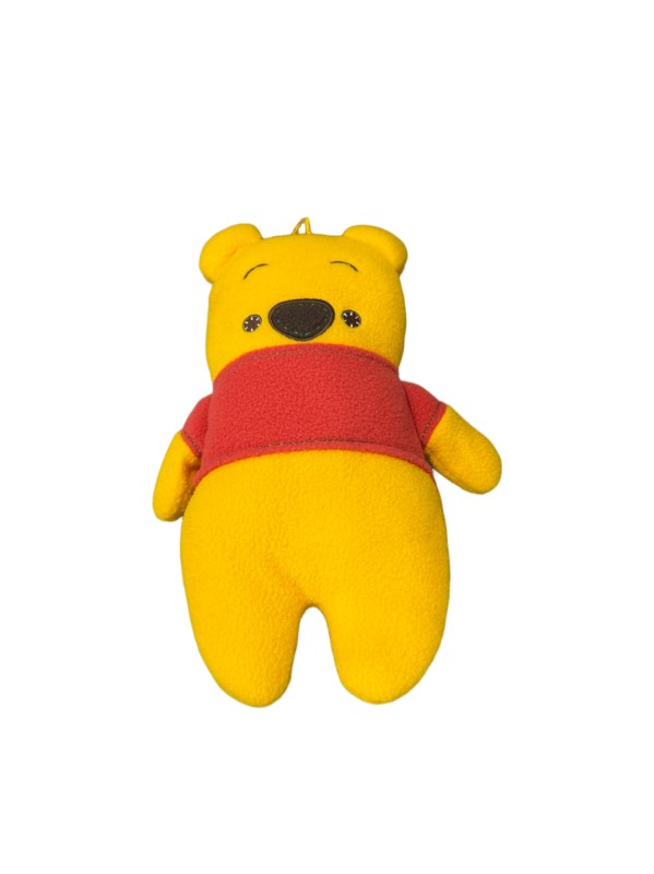 Winnie the Pooh plush — Yellow body, red shirt and short rounded limbs.